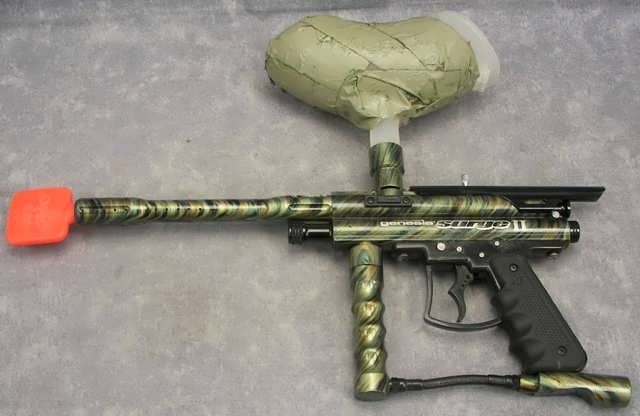   Surge II with forest camo paint job, barrel stopper, and hopper